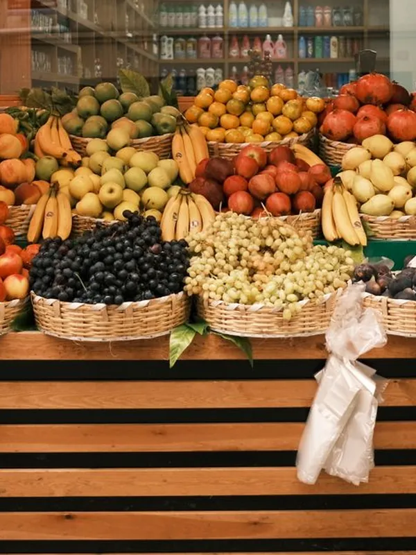 Baskets of fresh fruit outside a grocer's shop